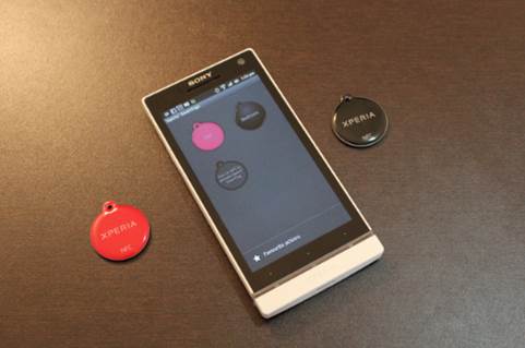 You can interact from your device with NFC tags. NFC tags are mounted with an NFC chip.