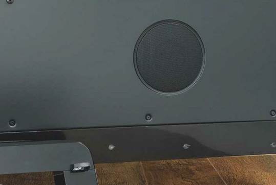 The LG's speaker system includes rear-firing mid-bass drivers