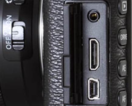 The connectors of the X-E1 are found on the left side of the camera, from top to bottom there is a 2.5mm socket for an external stereo microphone or wired remote shutter release, an HDMI connector for video playback, and a USB / AV-out pin. The USB port also accepts Fujifilm’s RR-80 wired release, while the microphone socket can be used with many remote release accessories that are compatible to Pentax or Canon.