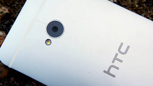 The camera lens is located in the middle of the back, just below the top strip; it is surrounded by a thin layer of polycarbonate and is slightly indented to keep glasses from getting scratched. You'll find an LED flash on the left of the camera, while the HTC logo is obligatory to sit in the center of the device.