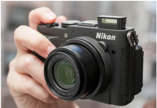 Nikon eliminated the optical viewfinder so that it could add a faster f/2-4 lens without increasing the camera’s size