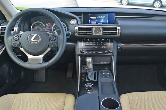 Lexus's tiered facia places controls close at hand, but the driving position is cramped