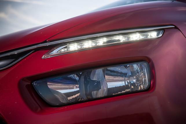 Sleek LED headlights fool on-lookers that they're the main lights, but real ones are below