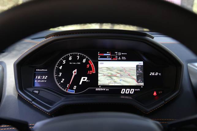 A digital instrument cluster features inside the Huracán
