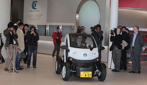 The NMC has four wheels, but they stand only 47 inches apart. The car is electric with a nominal range of 62 miles.