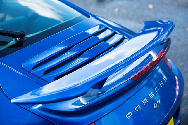 A 911 Turbo isn't a 911 Turbo without a rear wing. It has three positions: retracted, out, and out-and-tilted for maximum attack