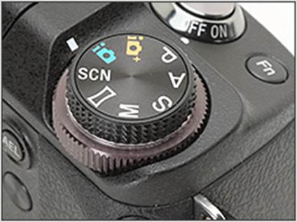 Description: Aside from the standard PASM modes, the mode dial of the NEX-6 provides both Superior and Intelligent Auto, Scene and Sweep Panorama modes. Directly below it is the greater diameter control dial.