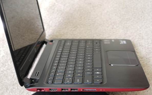 The envy 4 is business-like and understated on top, but underneath, its red based plate is all party.