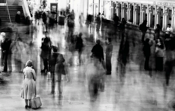Capture the hustle and bustle of a railway station using slow shutter speeds to create motion blur.